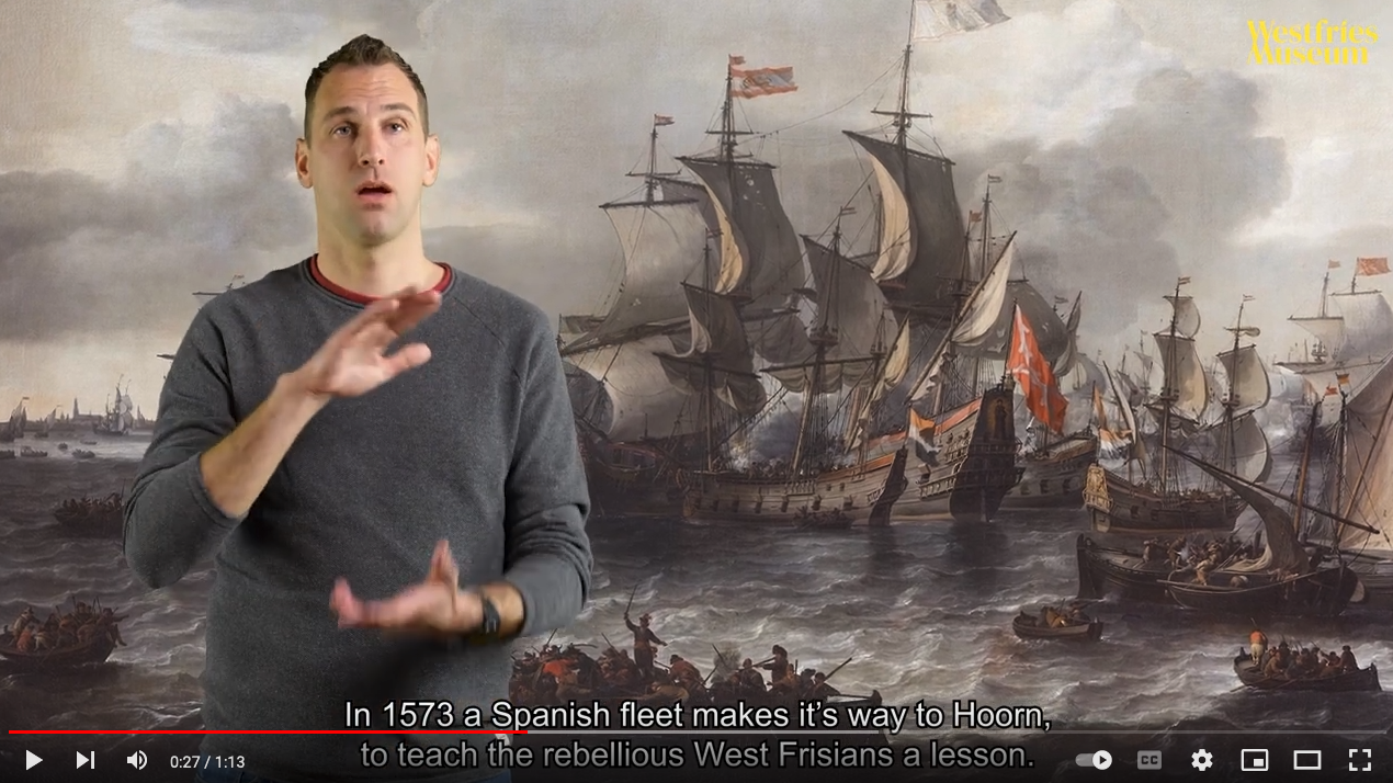 persoon beschrijft geprojecteerd beeld in gebarentaal