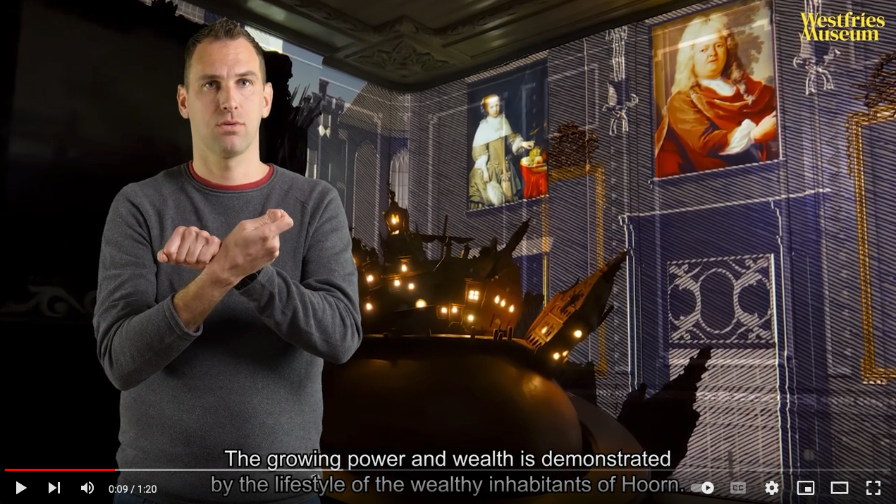 persoon beschrijft geprojecteerd beeld in gebarentaal